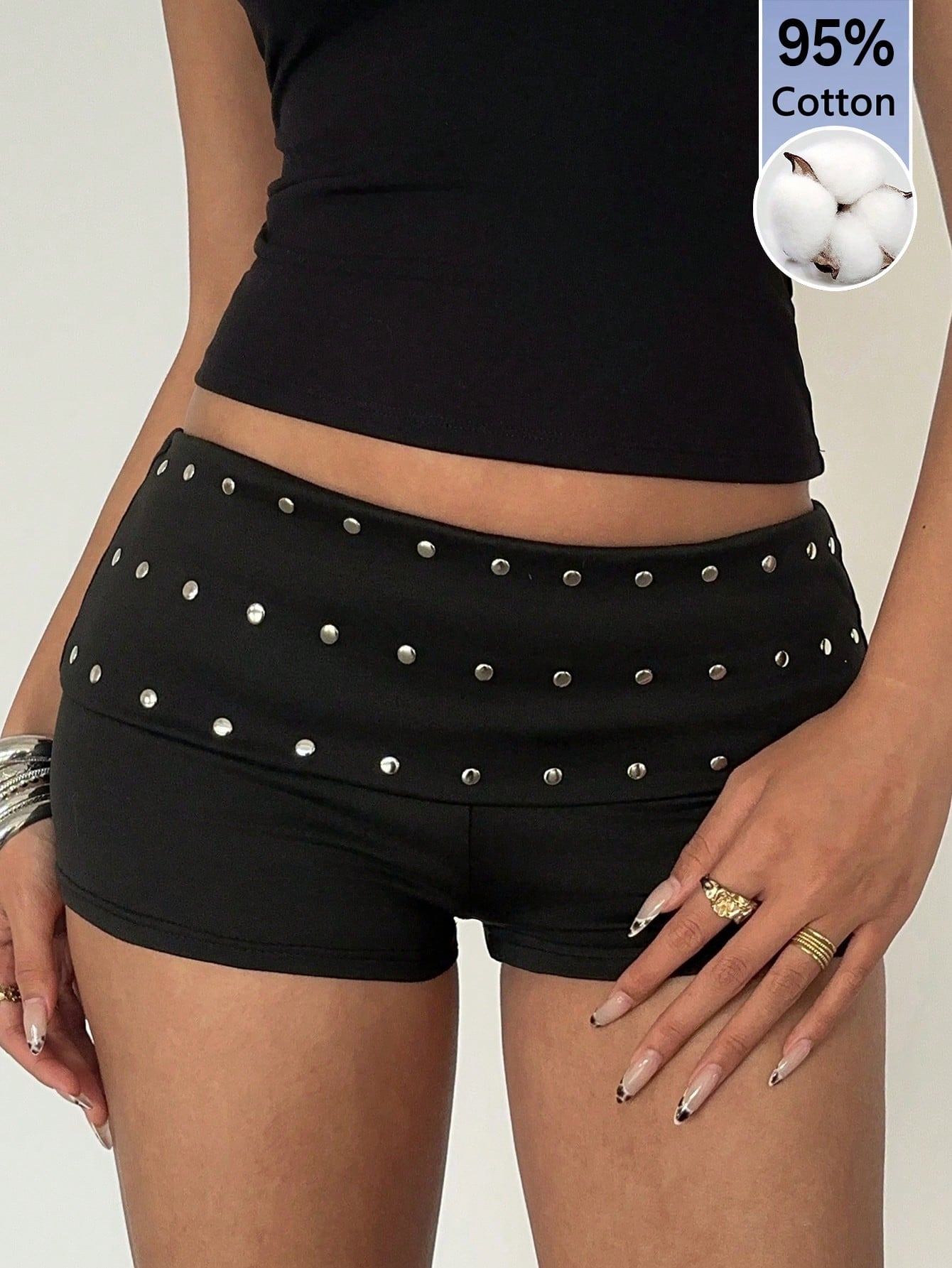 Women's studded PU ultra low waist mini shorts with zipper fly closure, skinny fit, mini length, and plain unlined design.