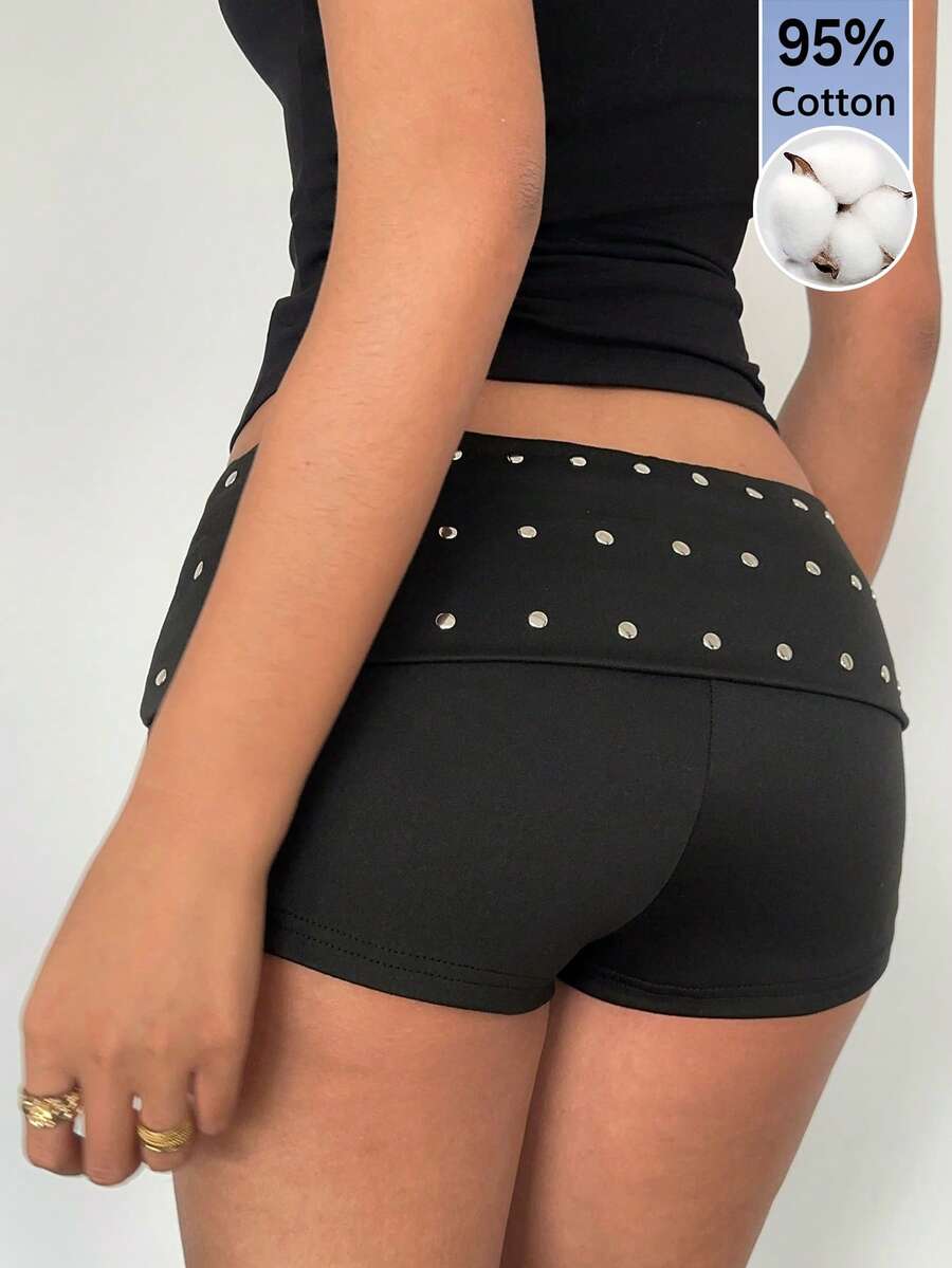 Women's studded PU ultra low waist mini shorts with zipper fly closure, skinny fit, mini length, and plain unlined design.