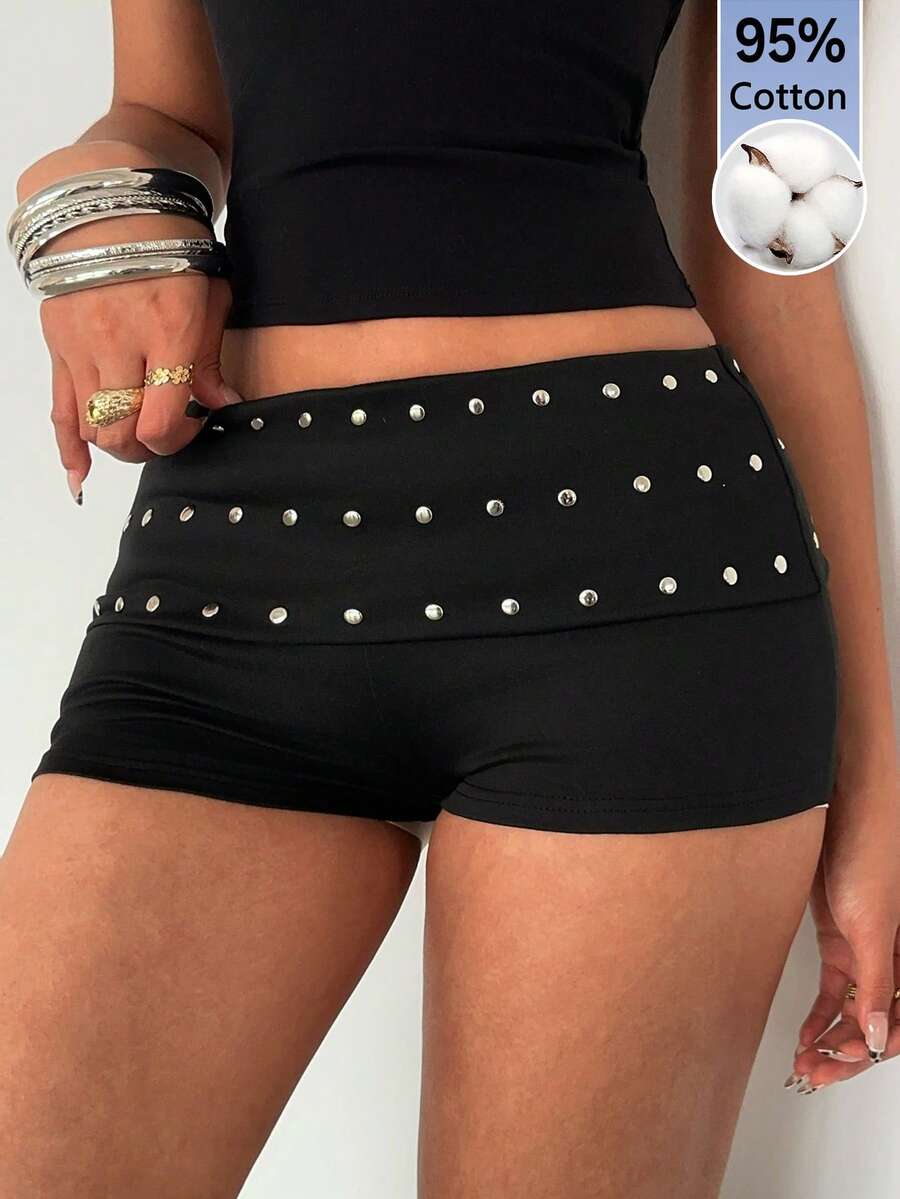 Women's studded PU ultra low waist mini shorts with zipper fly closure, skinny fit, mini length, and plain unlined design.