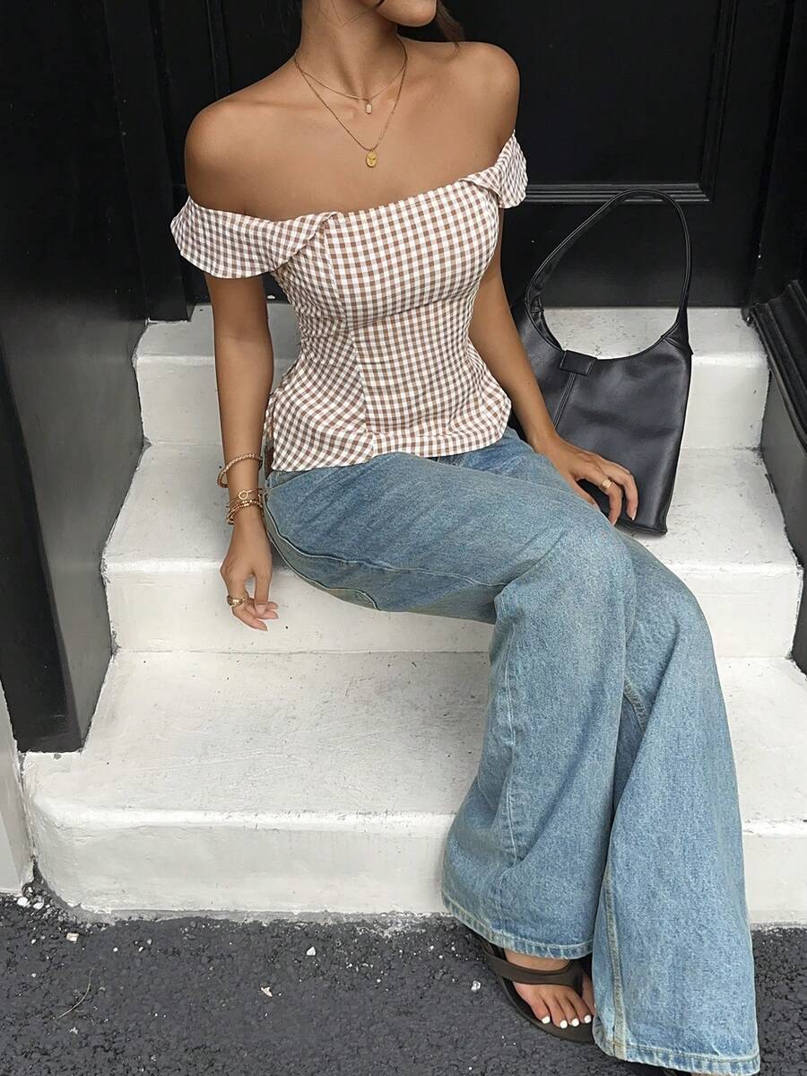 Brown gingham off-the-shoulder crop top for women featuring a slim fit, ruched design, cap sleeves, and knot detail.