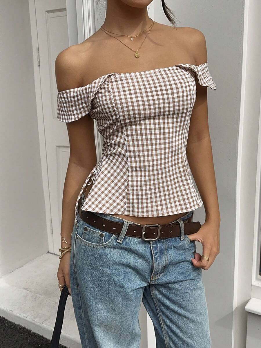 Brown gingham off-the-shoulder crop top for women featuring a slim fit, ruched design, cap sleeves, and knot detail.