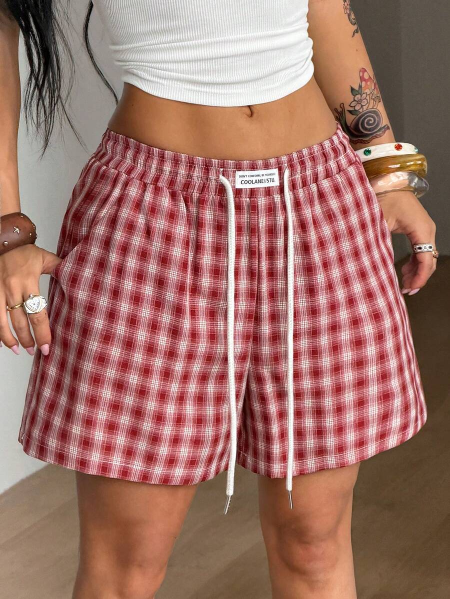 Women's casual drawstring track shorts featuring front pockets and embroidered details