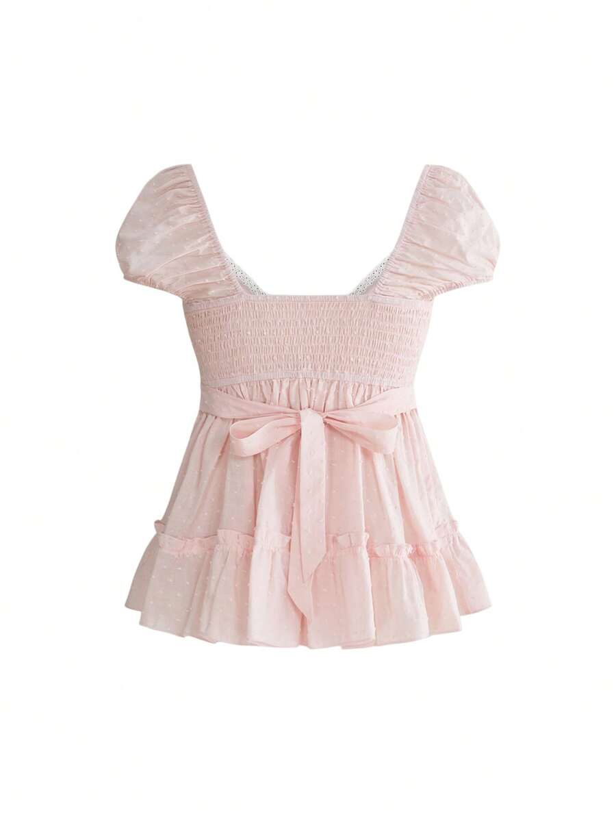 Women's deep V-neck cotton peplum blouse featuring short puff sleeves, delicate frill trim, and a flared hem.