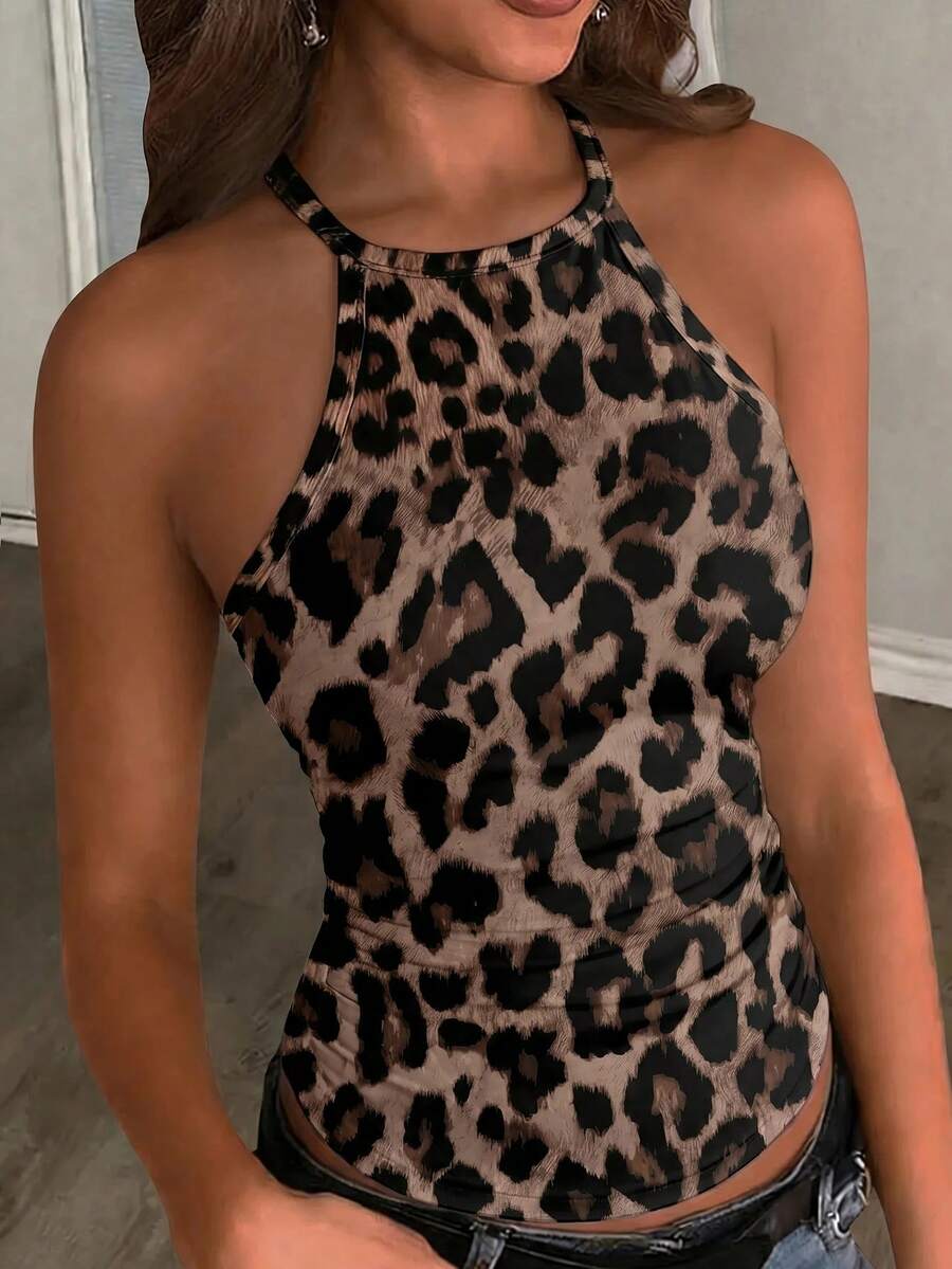 Multicolor women's graphic print halter tank top featuring a round neck, contrast binding, and backless design.