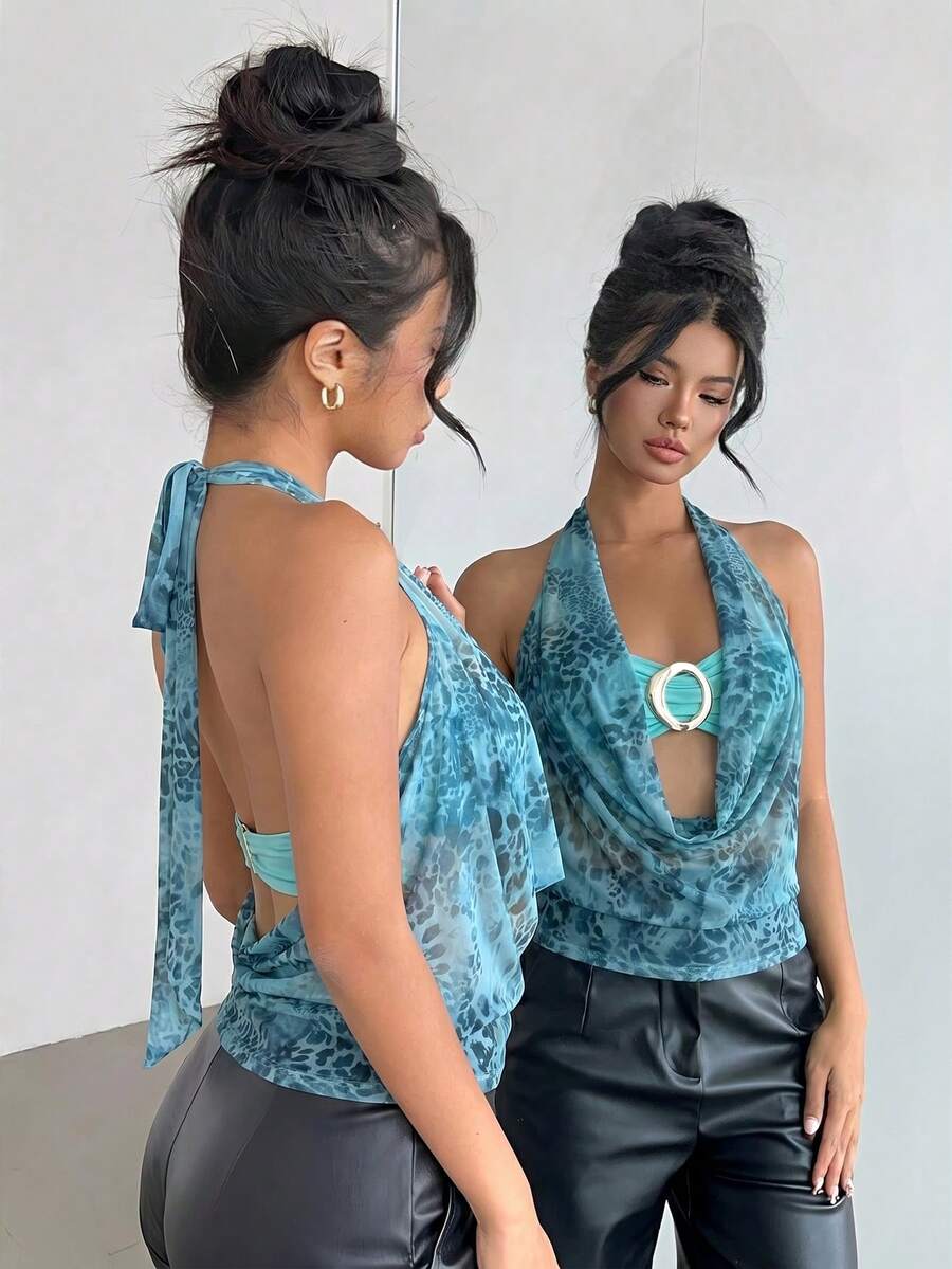 Brown and white polka dot semi-sheer halter camisole top with a plunging neckline, backless design, draped front, and metallic studded embellishments.