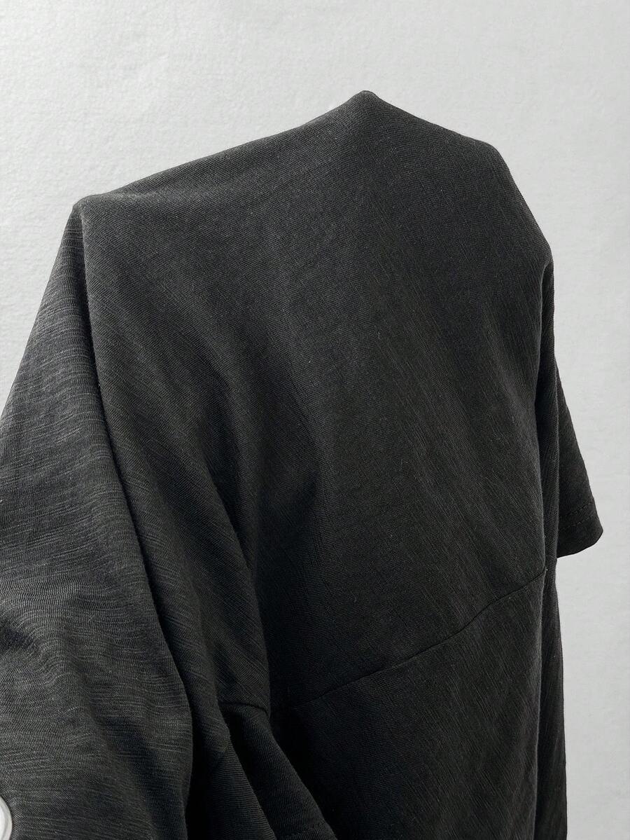 Women's casual loose fit cold shoulder cotton t-shirt with asymmetrical cutout neckline and short sleeves.