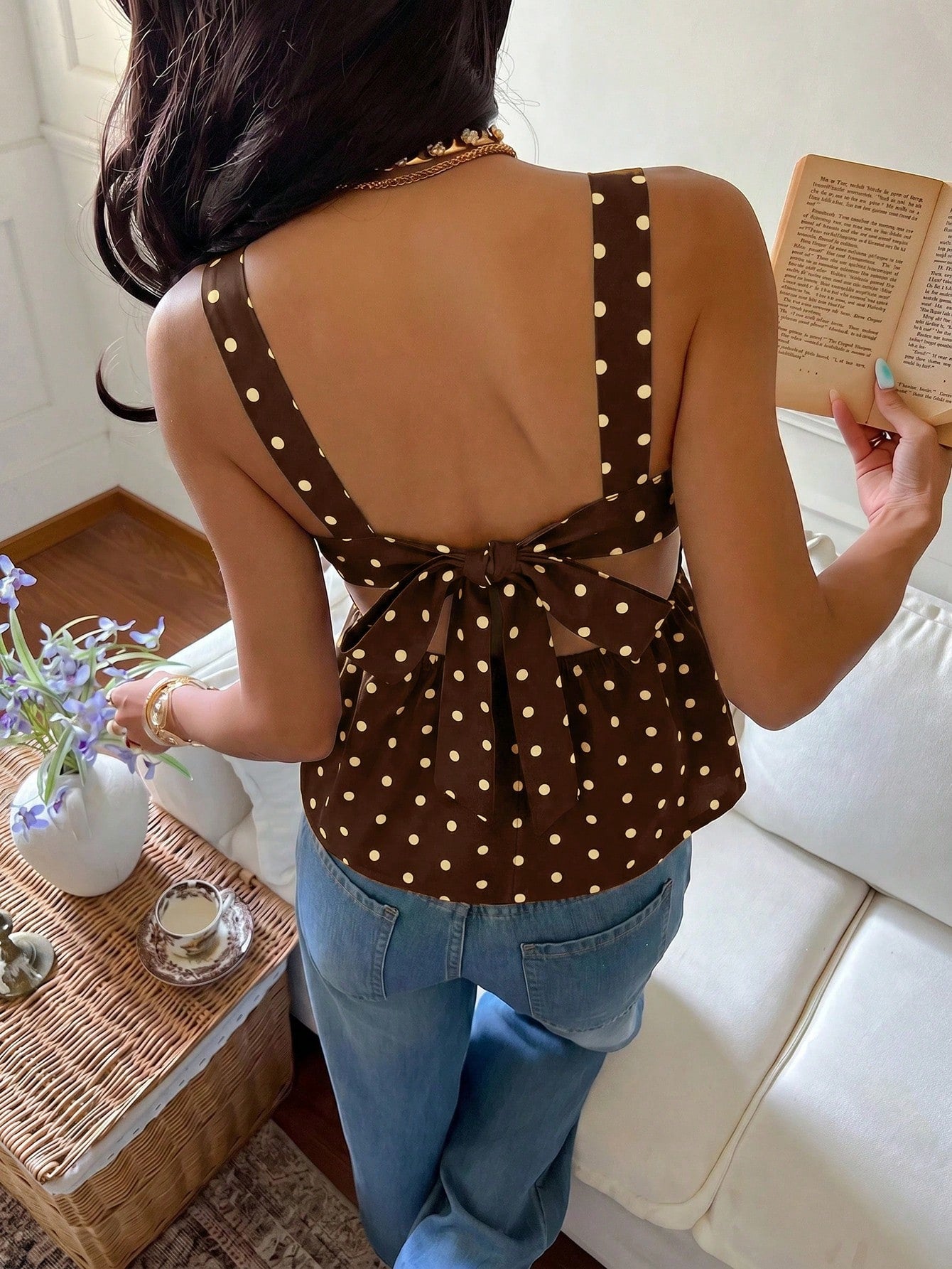 Women's casual polka dot tank top with tie-front knot, strap neckline, backless design, and ruffle flared hem