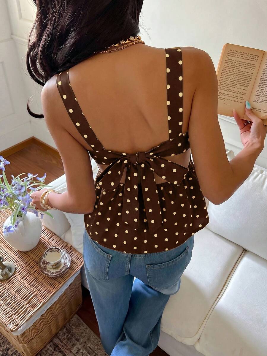 Women's casual polka dot tank top with tie-front knot, strap neckline, backless design, and ruffle flared hem