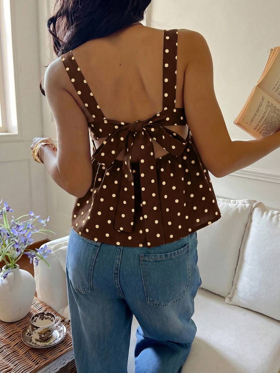 Women's casual polka dot tank top with tie-front knot, strap neckline, backless design, and ruffle flared hem