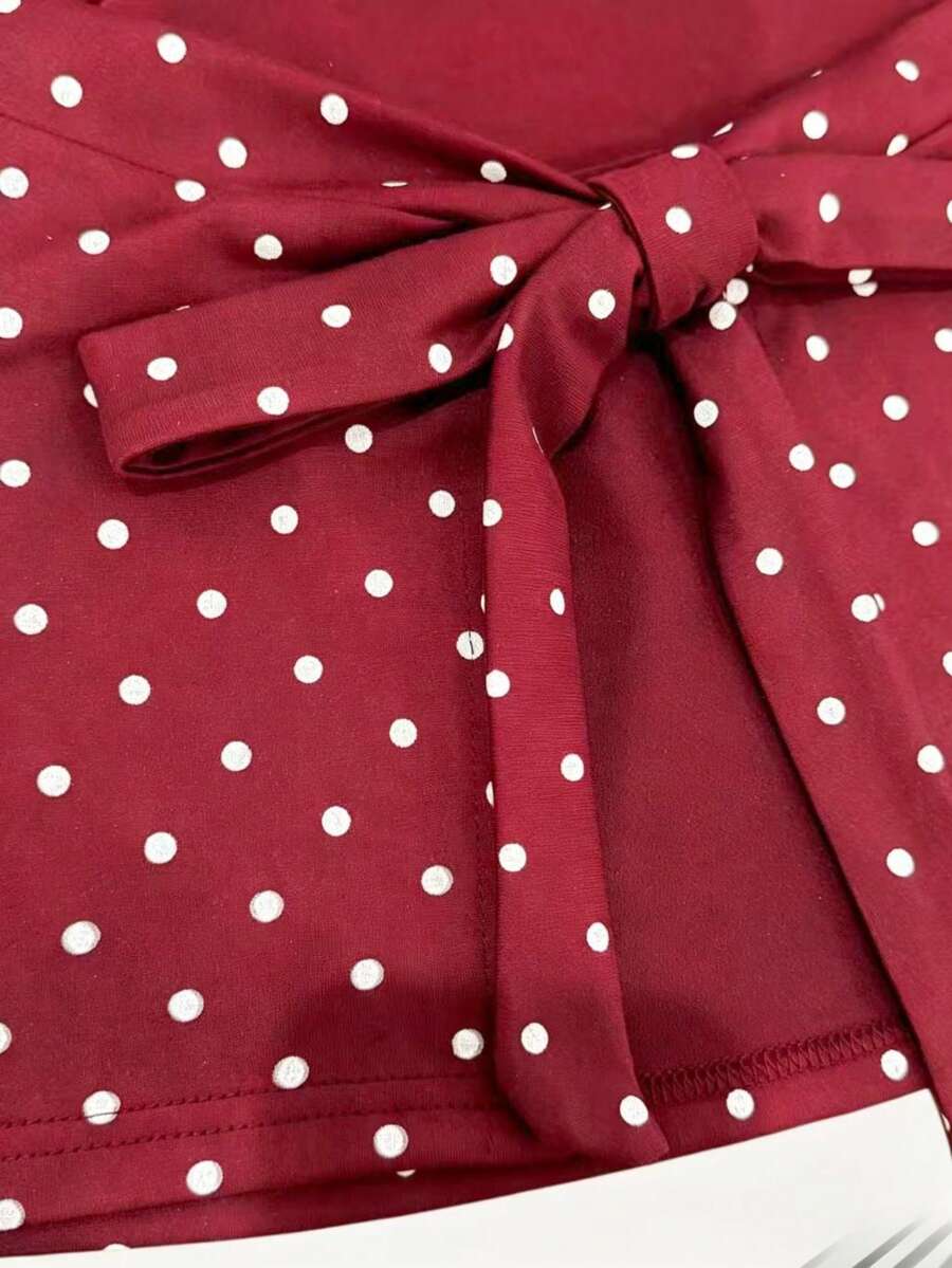 Women's cowl neck tie polka dot pleated tank blouse with ruched details and a regular fit