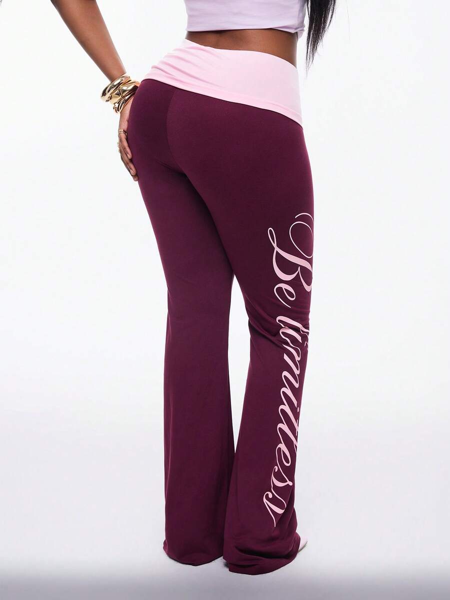 Women's black and white polka dot flare leg pants with side drawstring and ruched details