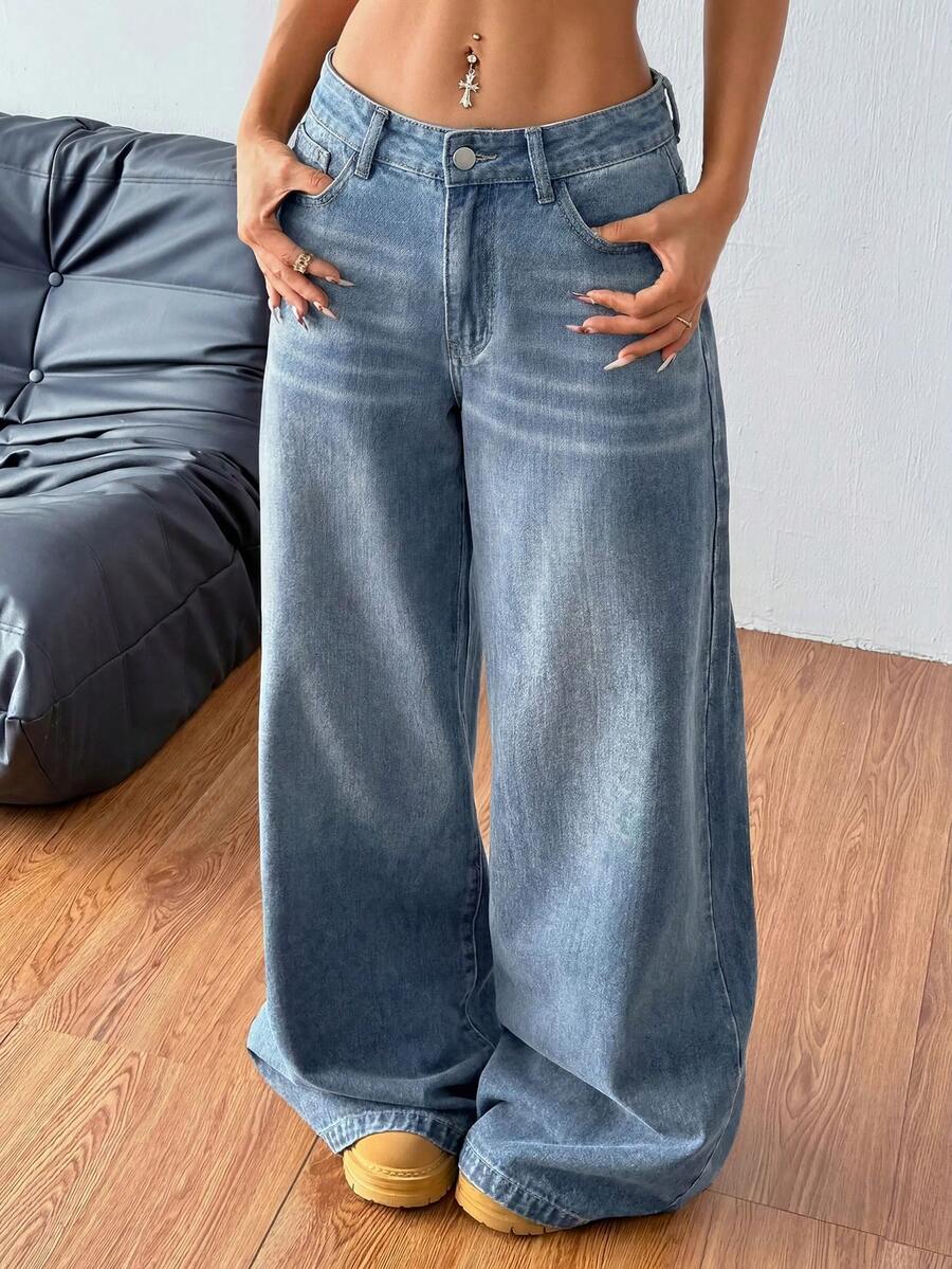 Women's relaxed fit wide leg denim jeans with pockets and a zipper fly.