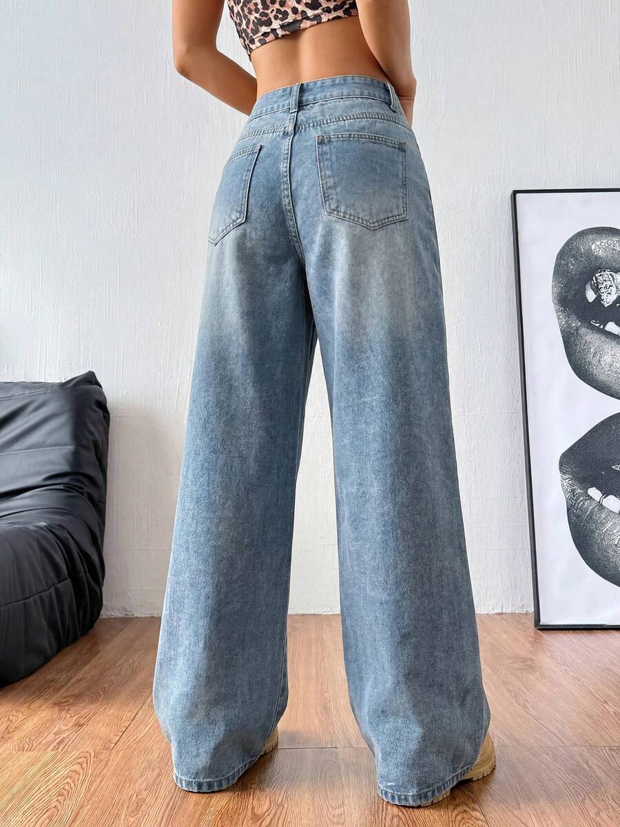 Women's relaxed fit wide leg denim jeans with pockets and a zipper fly.