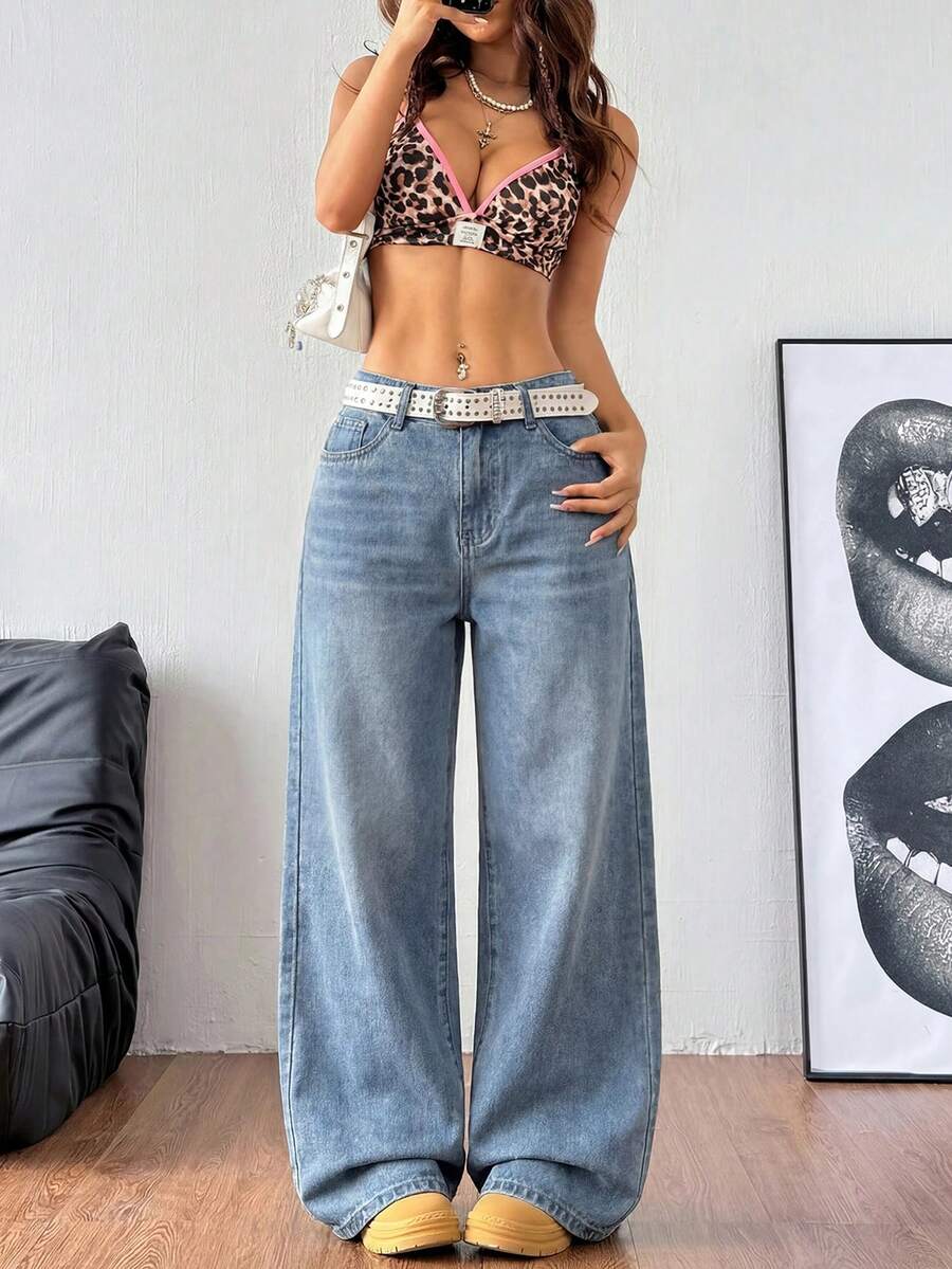Women's relaxed fit wide leg denim jeans with pockets and a zipper fly.