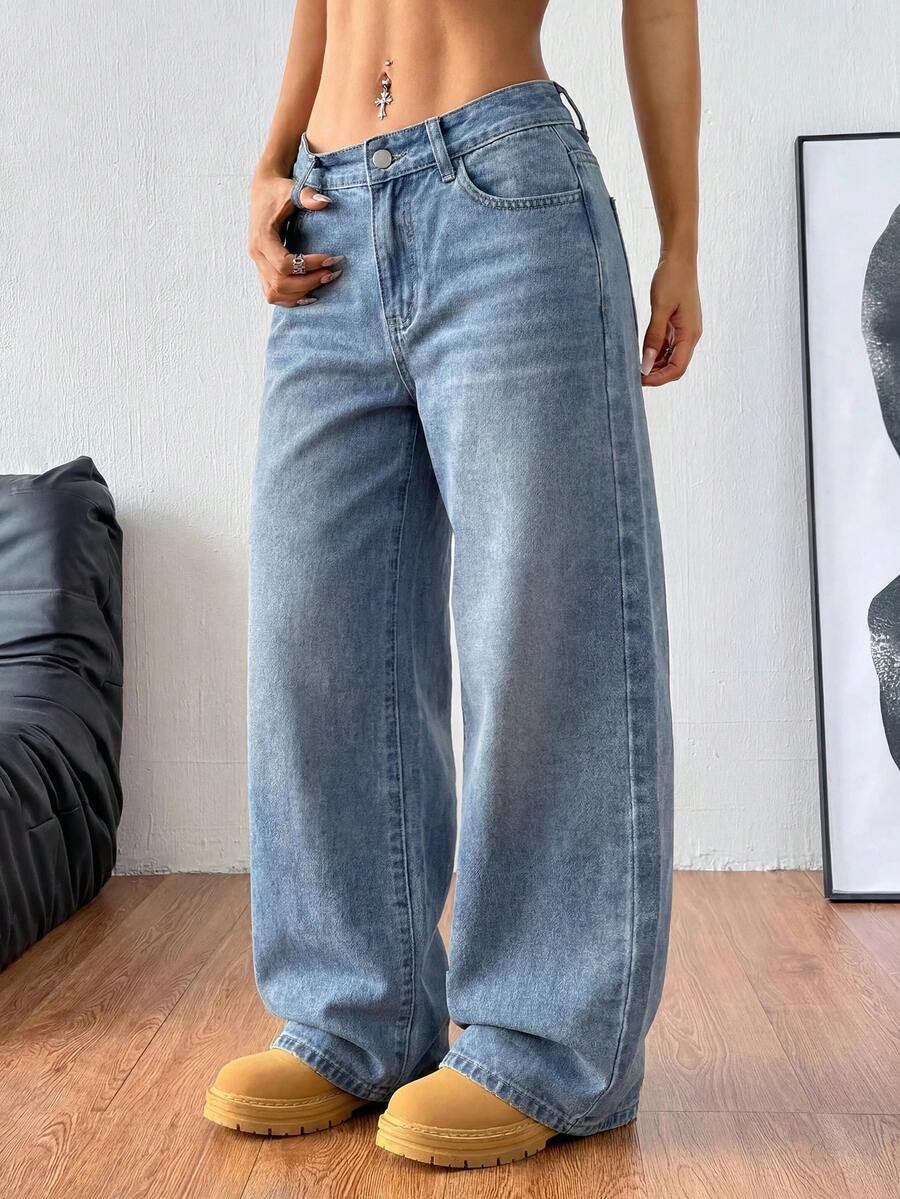 Women's relaxed fit wide leg denim jeans with pockets and a zipper fly.