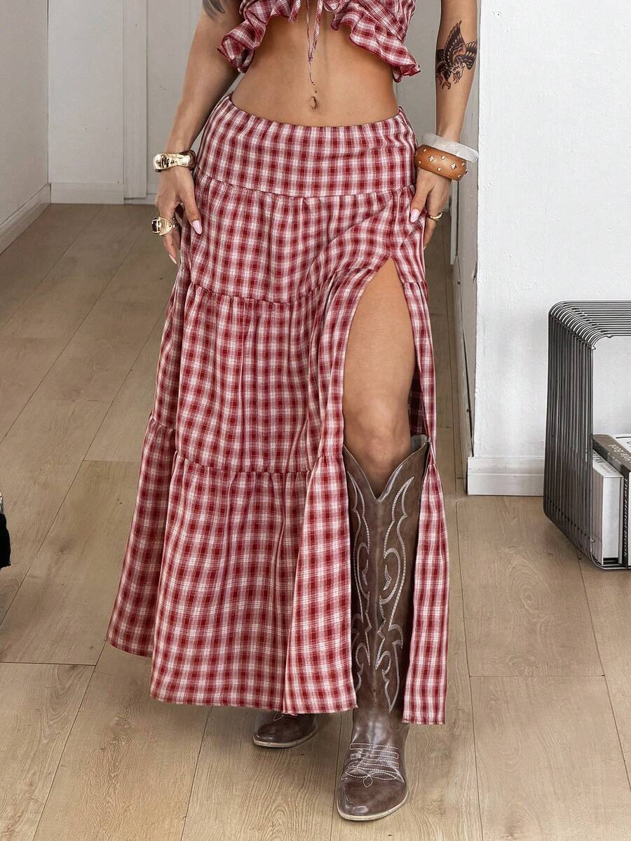 Women's red plaid long skirt featuring a low-rise waist and a side slit in lightweight woven fabric.
