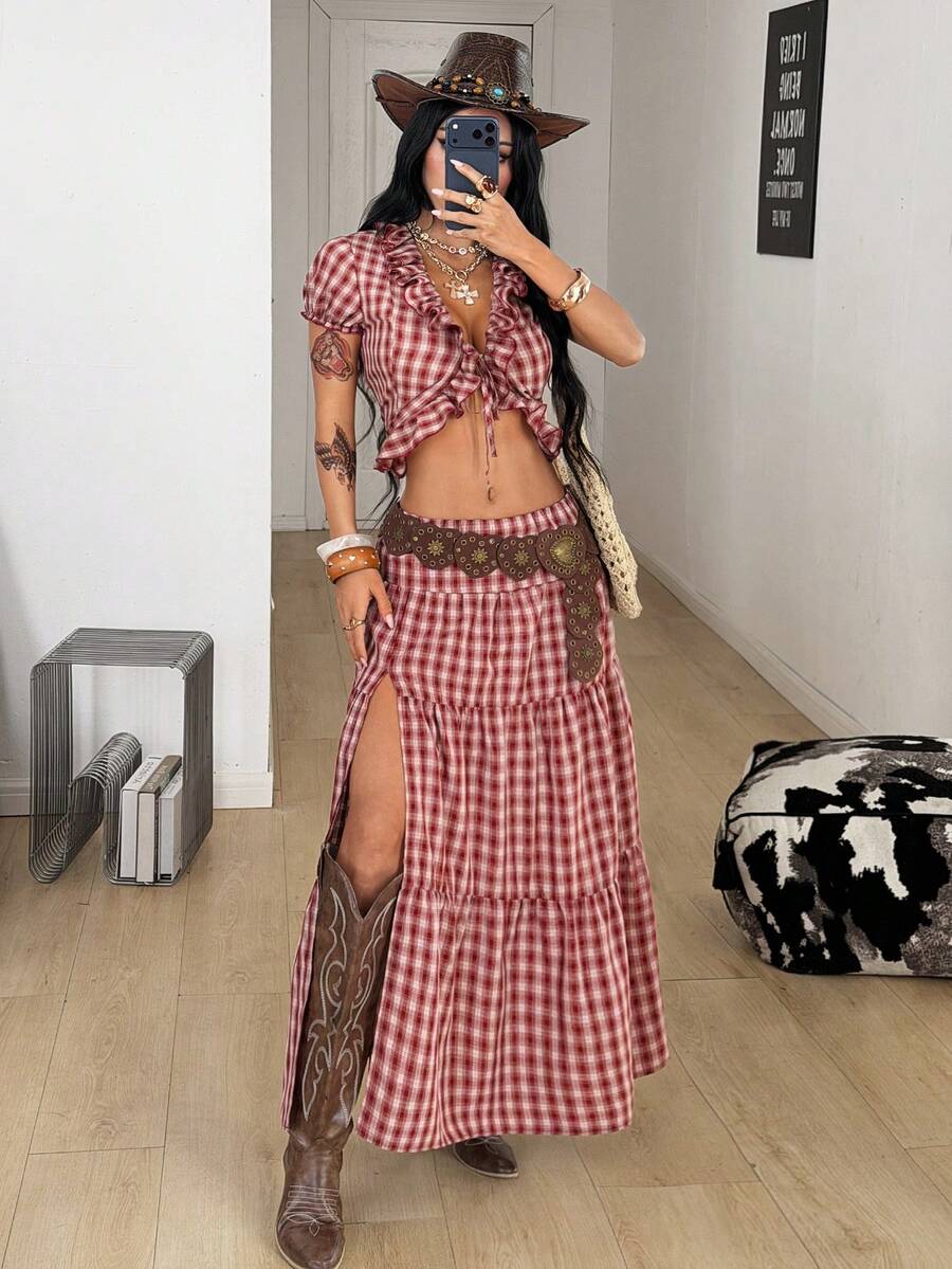 Women's red plaid long skirt featuring a low-rise waist and a side slit in lightweight woven fabric.