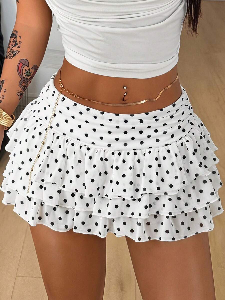 Women's white low waist tiered mini skirt featuring ruched detailing and a slight-stretch knitted fabric.