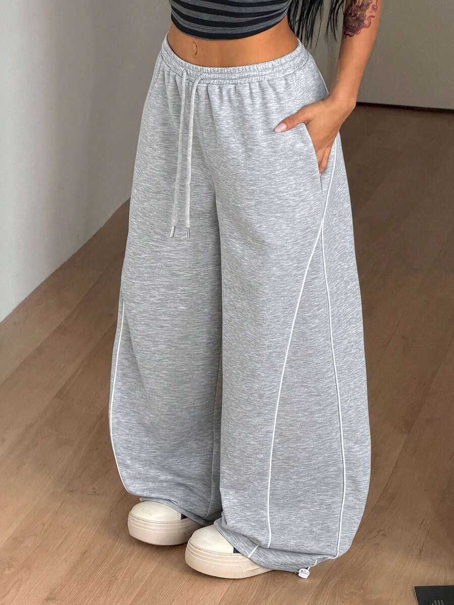 Women's wide leg trousers with a tree branch graphic pattern, loose fit, and mid-rise waist in woven fabric.