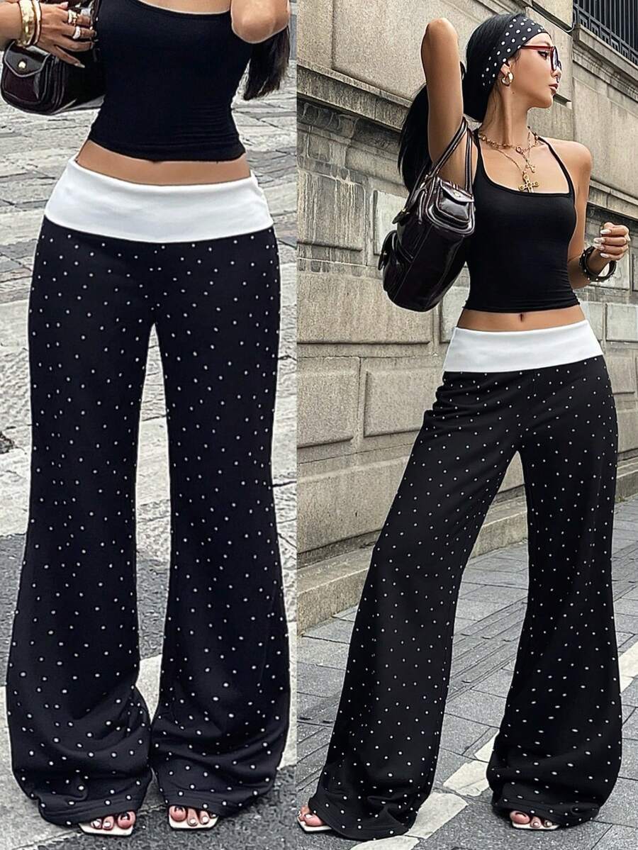 Women's black low waist wide leg flare sweatpants with rib-knit texture and contrast binding details.