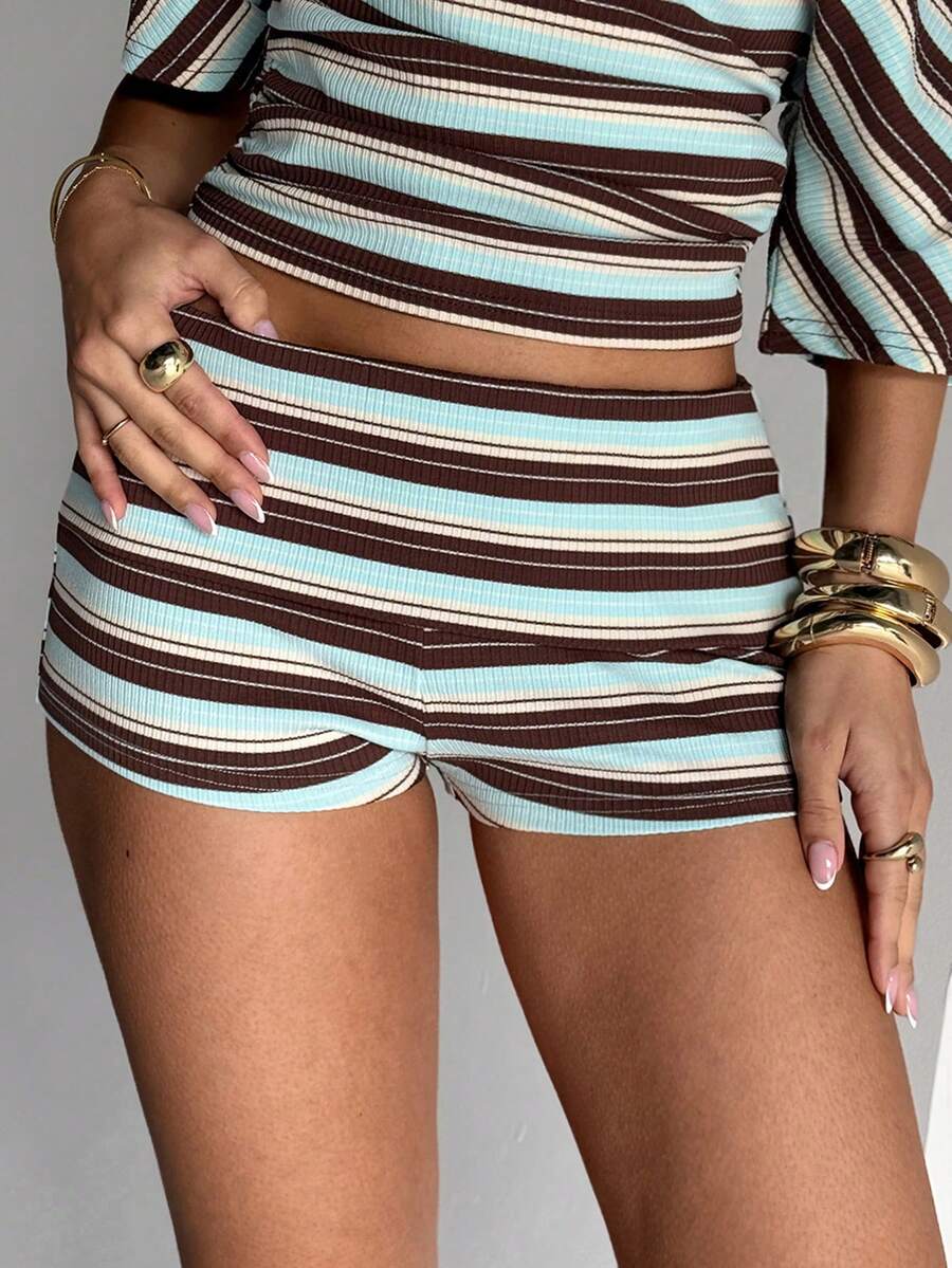 Women's studded PU ultra low waist mini shorts with zipper fly closure, skinny fit, mini length, and plain unlined design.