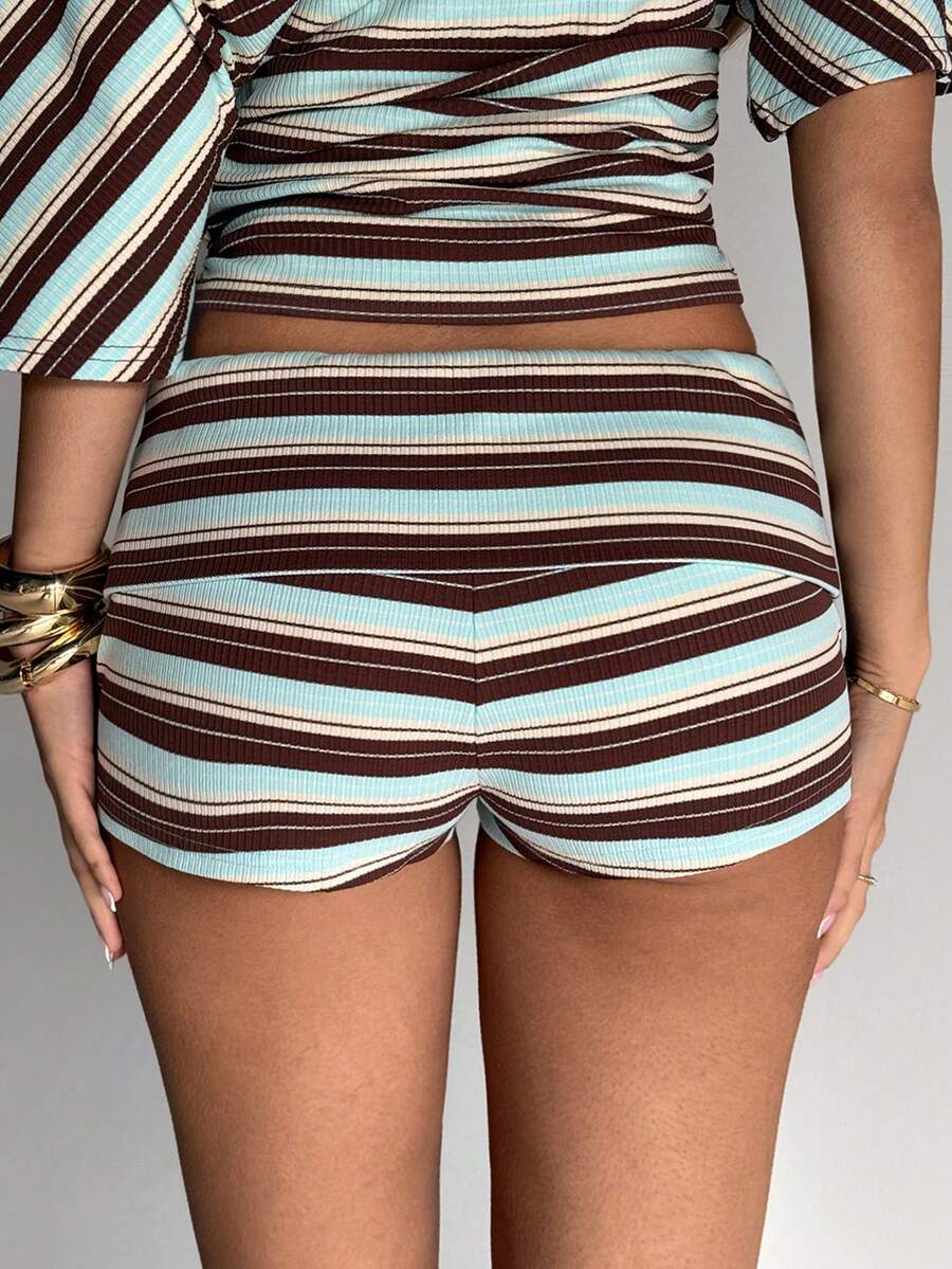Women's studded PU ultra low waist mini shorts with zipper fly closure, skinny fit, mini length, and plain unlined design.
