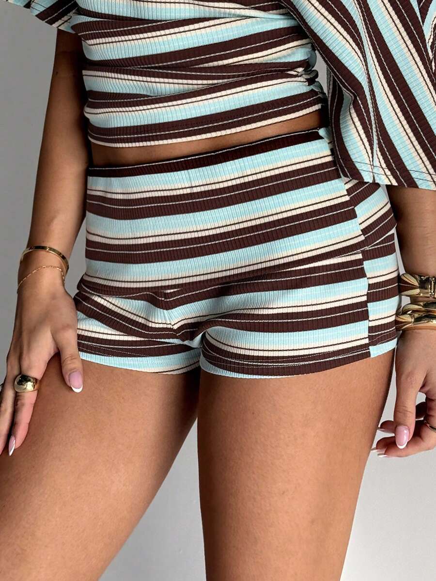 Women's studded PU ultra low waist mini shorts with zipper fly closure, skinny fit, mini length, and plain unlined design.