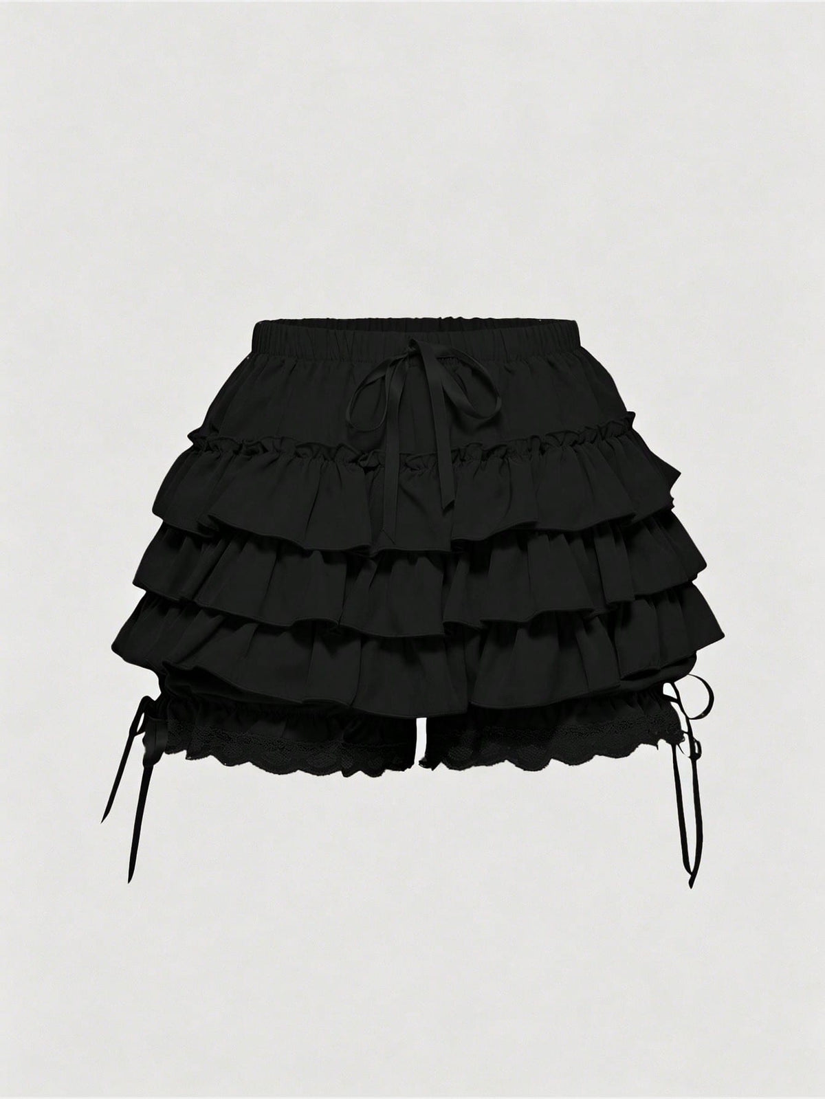 Women's tiered ruffle skort shorts featuring an elastic mid waist with front tie knot detail in woven fabric.