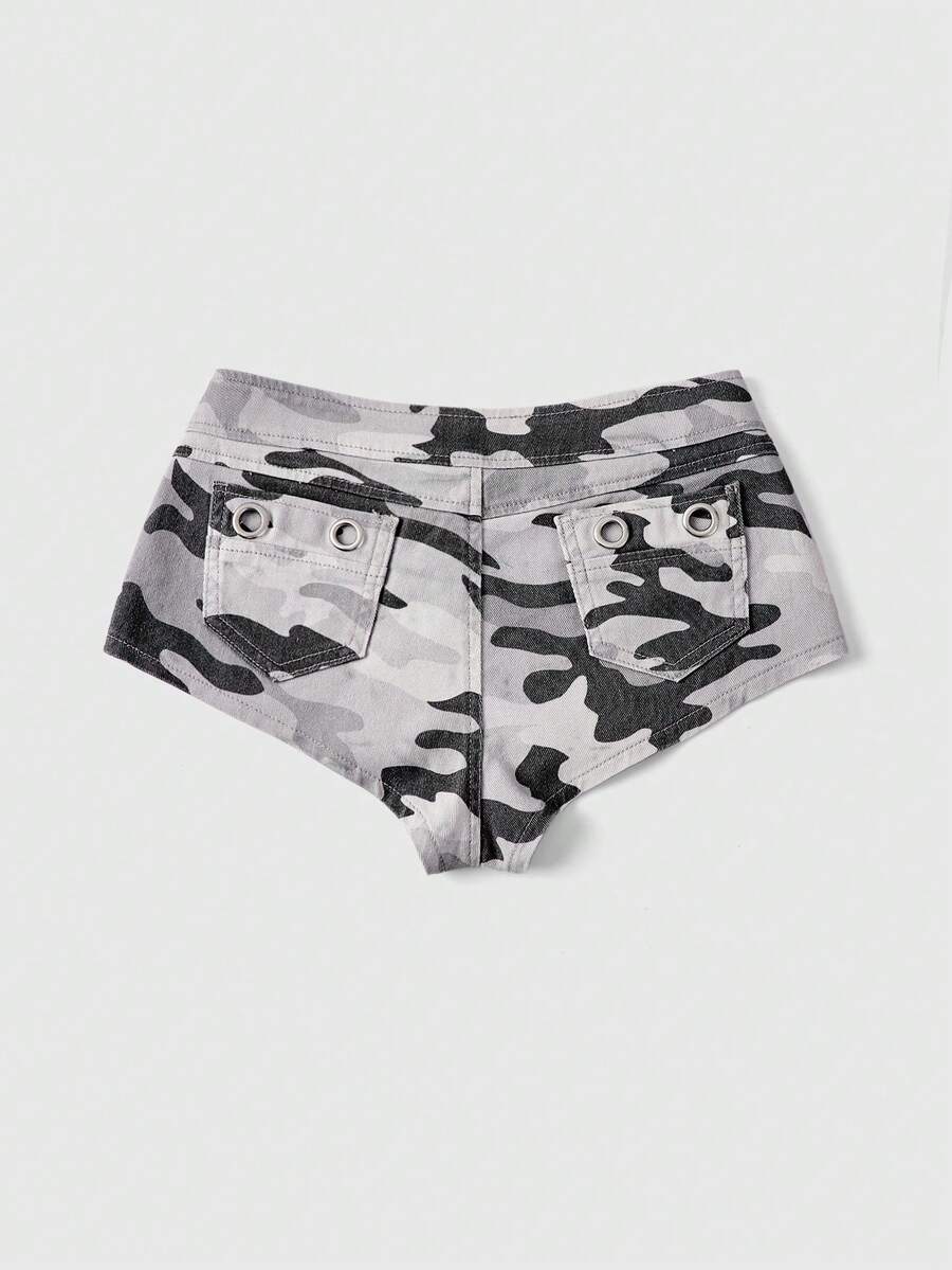 Women's ultra low waist camouflage mini skort shorts with zipper fly, button detail, and grommet eyelet accents.