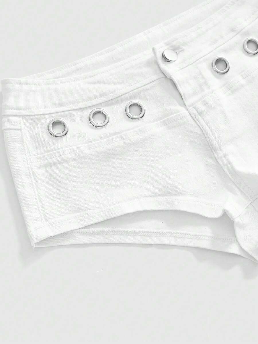 Women's ultra low waist camouflage mini skort shorts with zipper fly, button detail, and grommet eyelet accents.