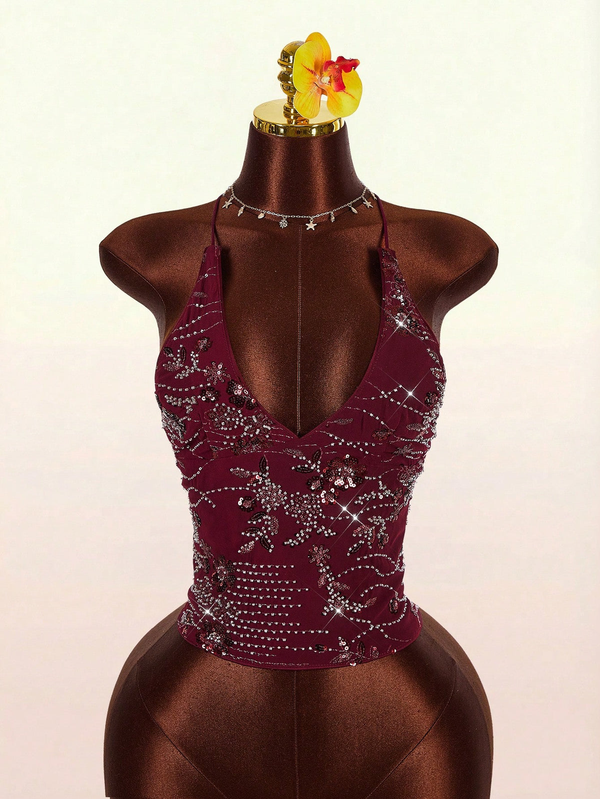 Women's embroidered sequin halter cami top featuring a deep V-neck, backless party design, and slim fit silhouette.