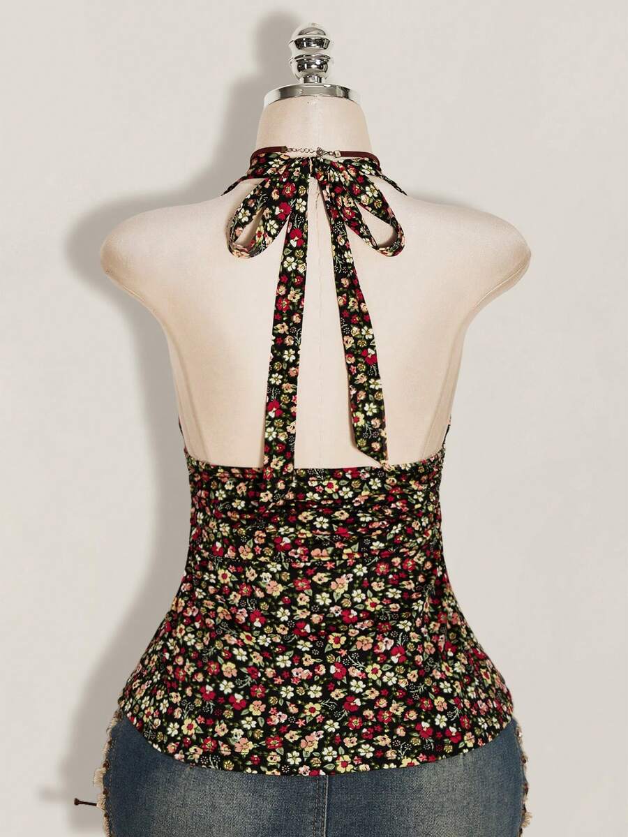 Women's backless halter babydoll tank top featuring a square neckline, slim fit silhouette, and a flared ruffle hem.