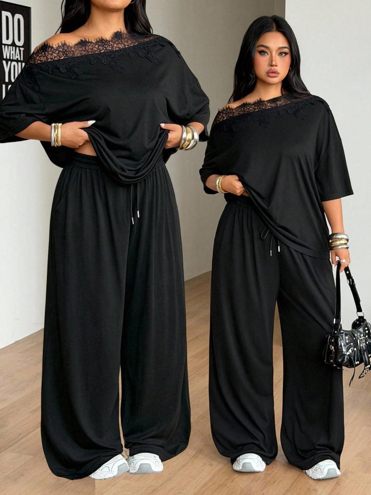Women's casual two-piece outfit featuring a loose short-sleeve asymmetrical neck t-shirt and matching long wide leg pants with pockets.