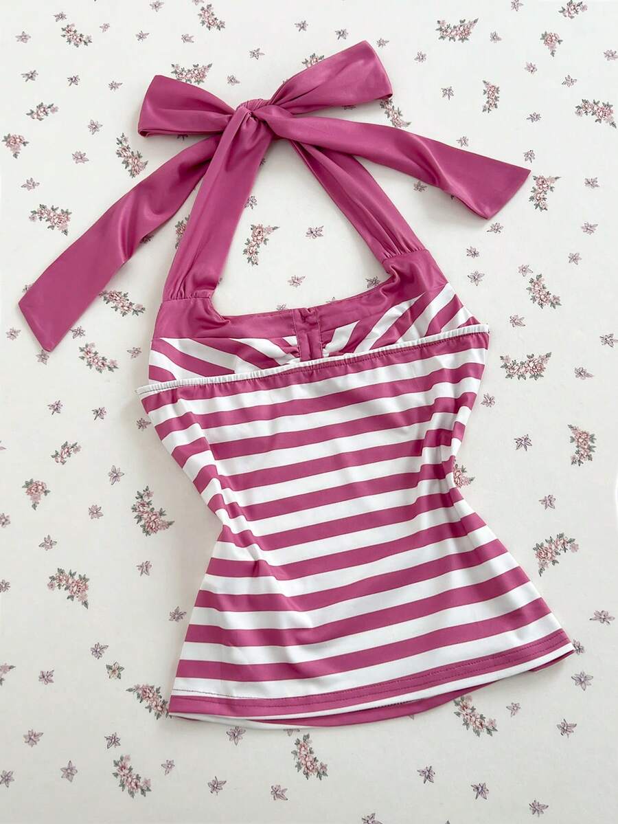 Women's multicolor striped halter top featuring a bow detail and slim fit design.