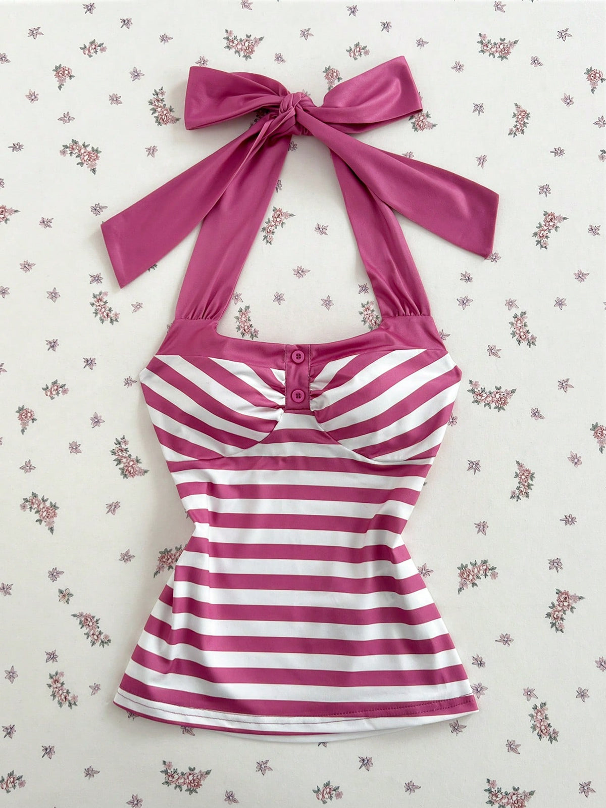 Women's multicolor striped halter top featuring a bow detail and slim fit design.