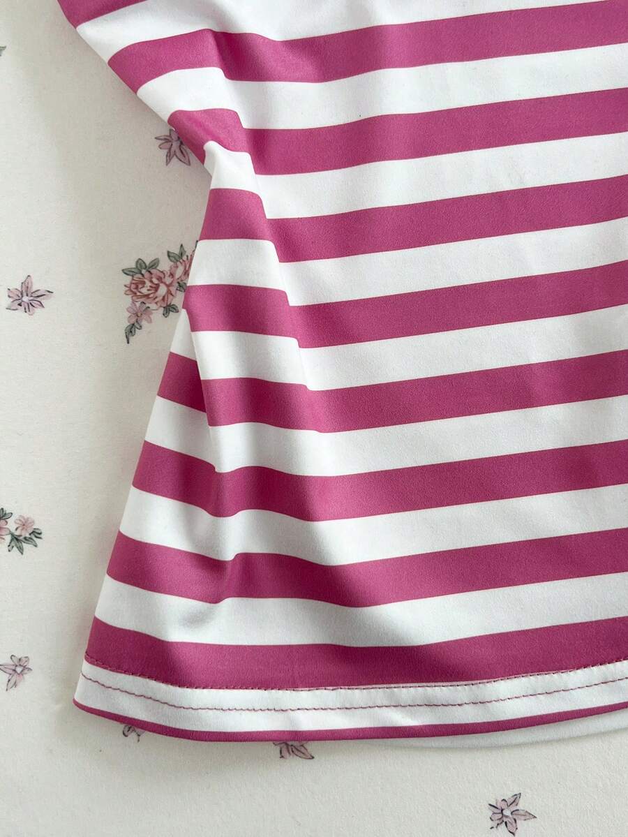 Women's multicolor striped halter top featuring a bow detail and slim fit design.