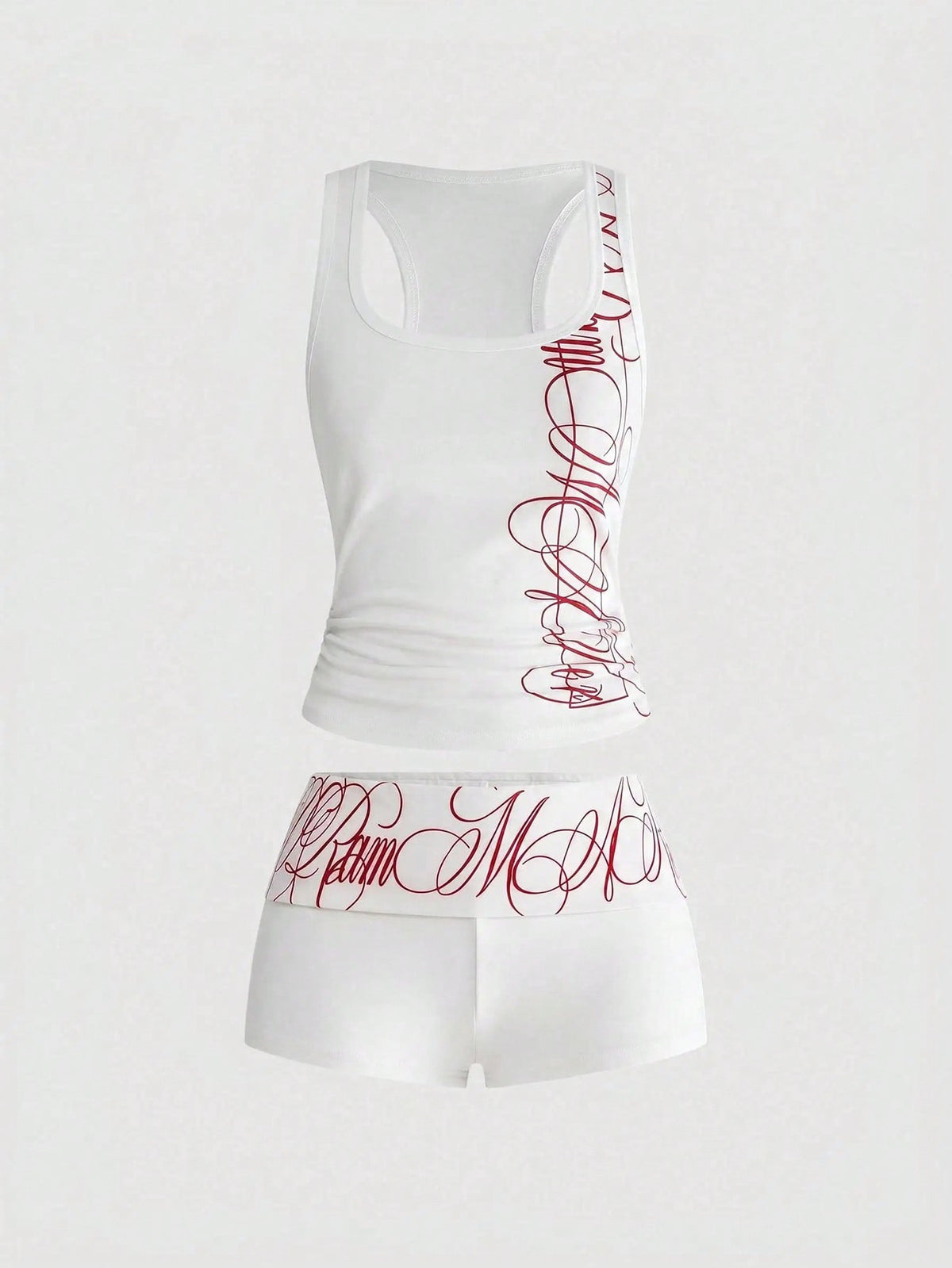 Punk-inspired two-piece set with a fitted scoop neck slogan tank top featuring cross and rhinestone details paired with ultra low waist mini shorts.