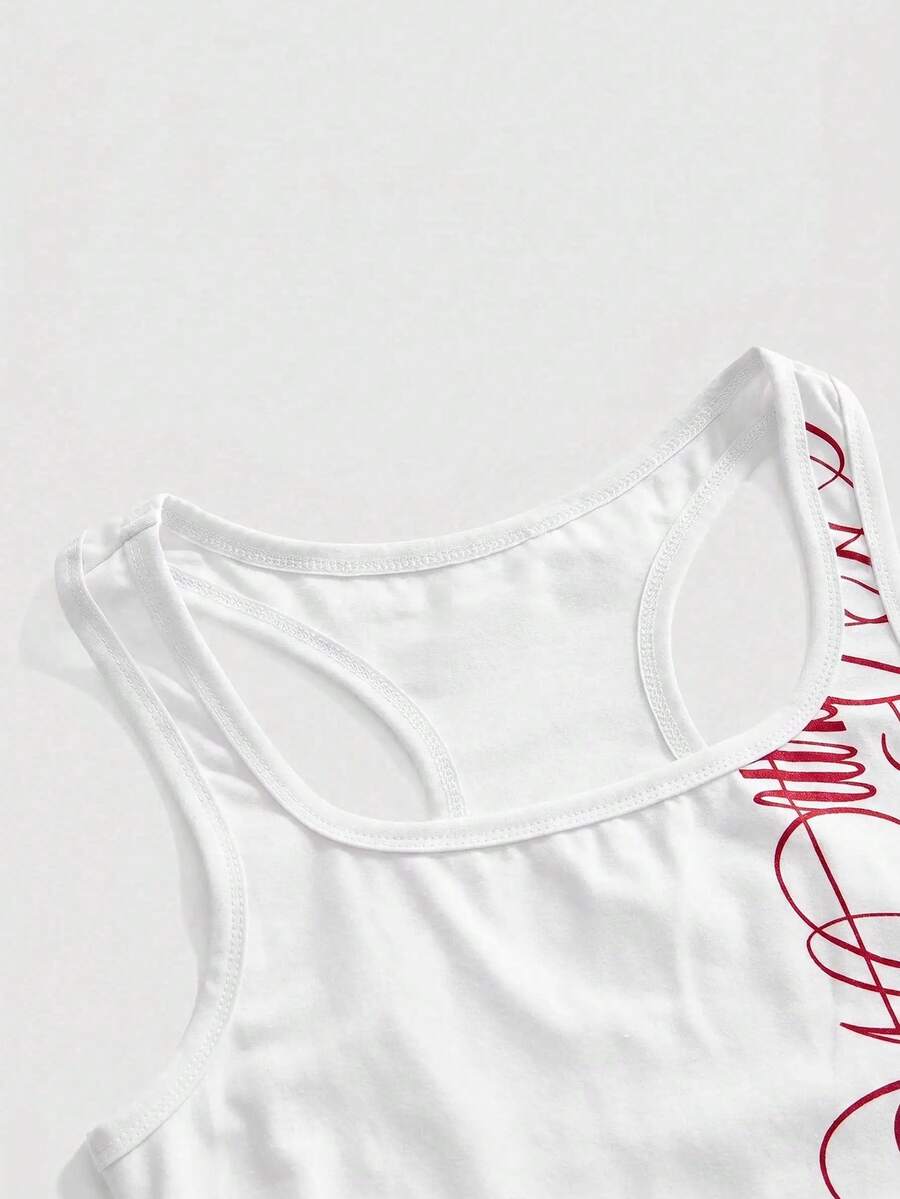 Punk-inspired two-piece set with a fitted scoop neck slogan tank top featuring cross and rhinestone details paired with ultra low waist mini shorts.