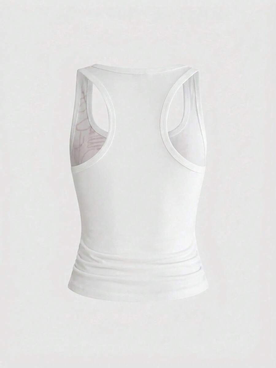 Punk-inspired two-piece set with a fitted scoop neck slogan tank top featuring cross and rhinestone details paired with ultra low waist mini shorts.