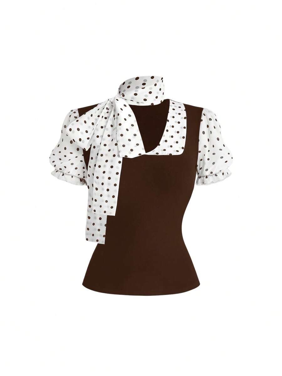 Women's black short puff sleeve graphic print t-shirt featuring a sweetheart neckline and knot detail.