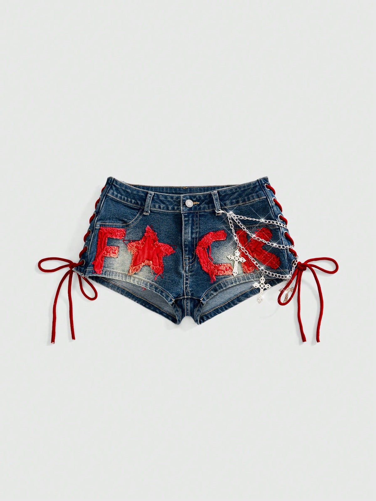 Women's Y2K low waist camo mini skort shorts featuring lace-up knot details, grommet eyelets, graphic lettering pattern, and a zipper fly.