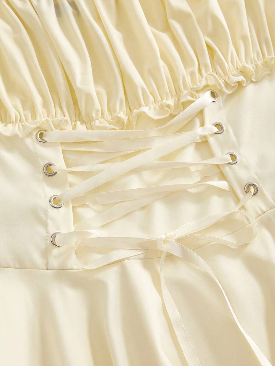 Women's fairycore renaissance cold shoulder short dress featuring spaghetti straps, lace-up backless detail, frill trim, and an asymmetrical hem.