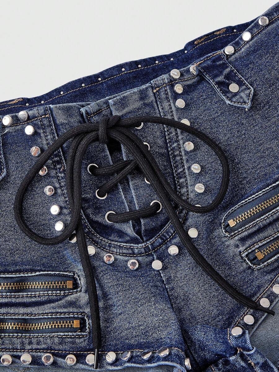 Women's low-rise studded denim mini shorts with a skinny fit and stretch fabric.