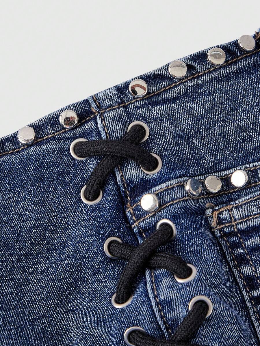 Women's low-rise studded denim mini shorts with a skinny fit and stretch fabric.