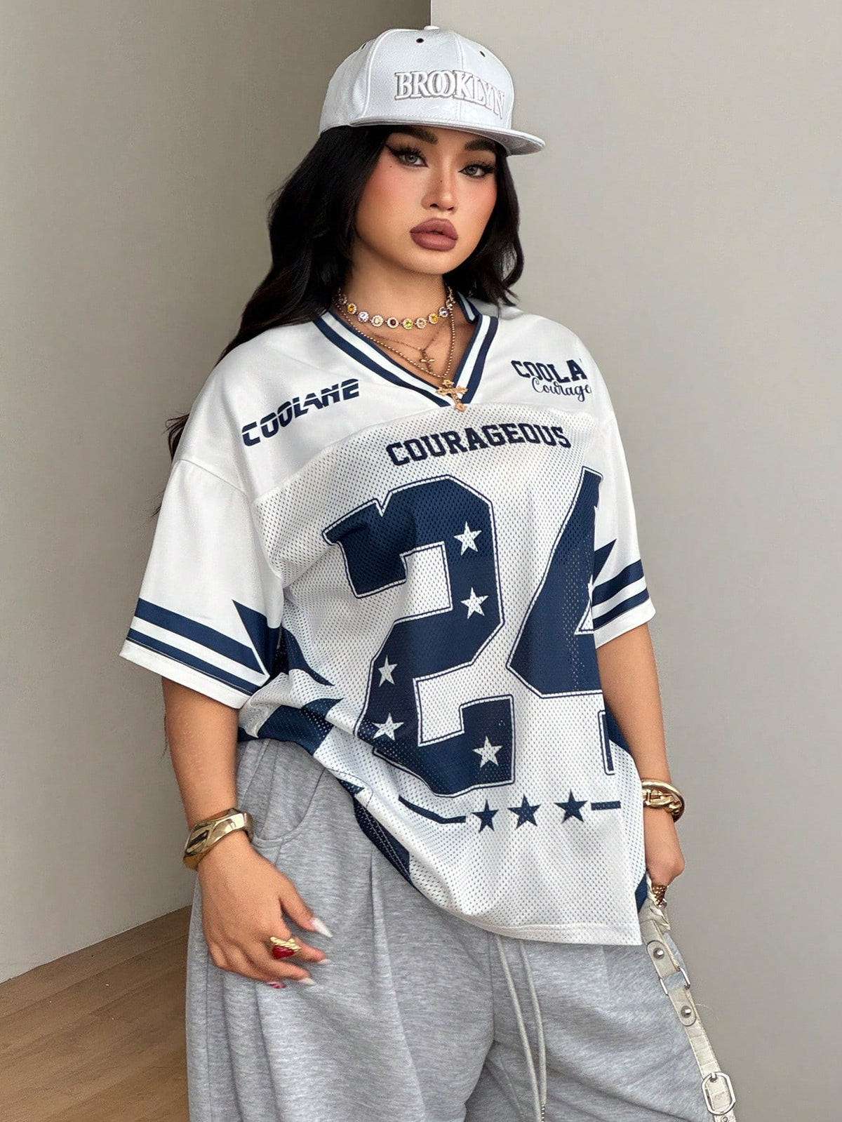 Navy blue plus size mesh baseball jersey t-shirt featuring a V-neck, raglan half sleeves, and sporty letter detailing.