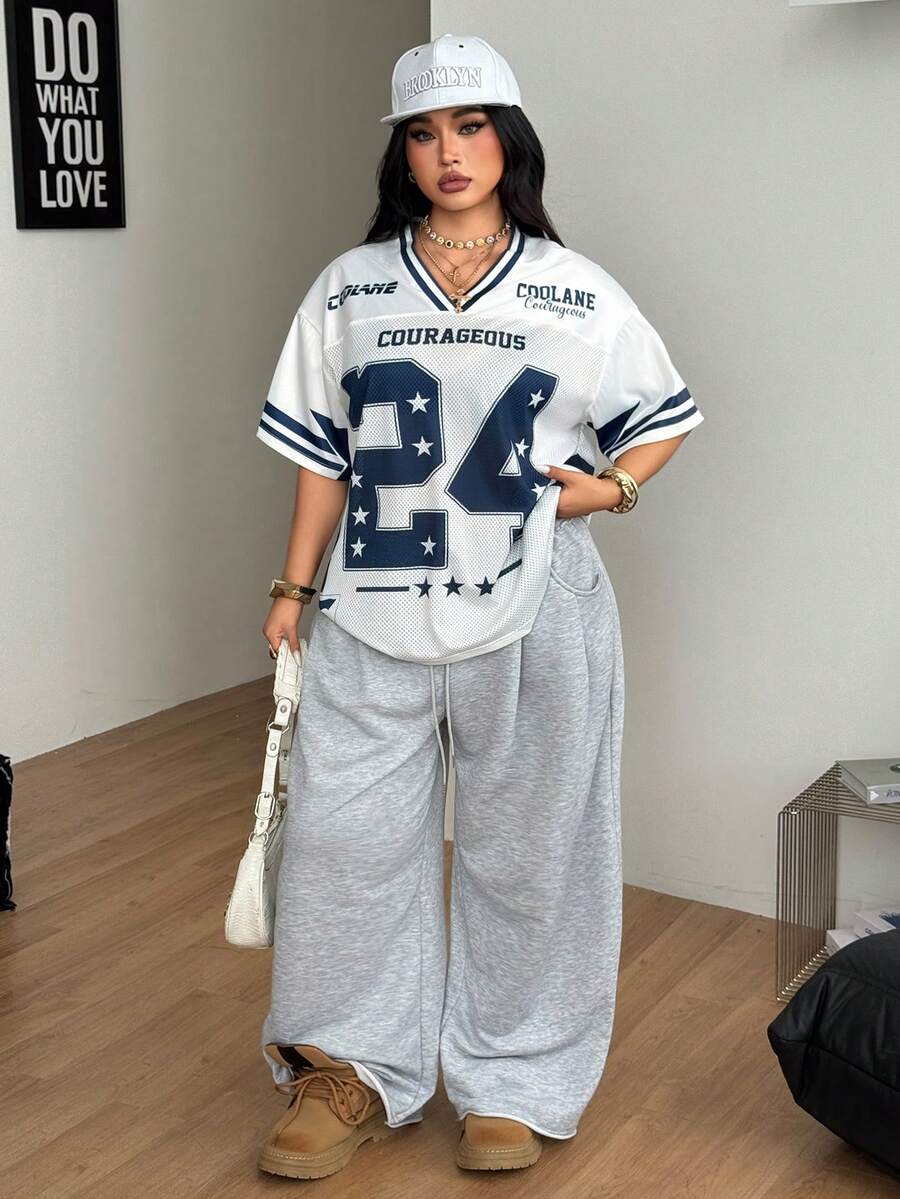 Navy blue plus size mesh baseball jersey t-shirt featuring a V-neck, raglan half sleeves, and sporty letter detailing.