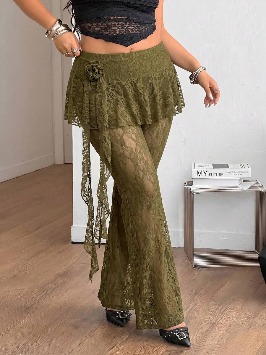 Black high-waist flare leg pants featuring contrast lace trim, floral ribbon detail, and semi-sheer knitted fabric.