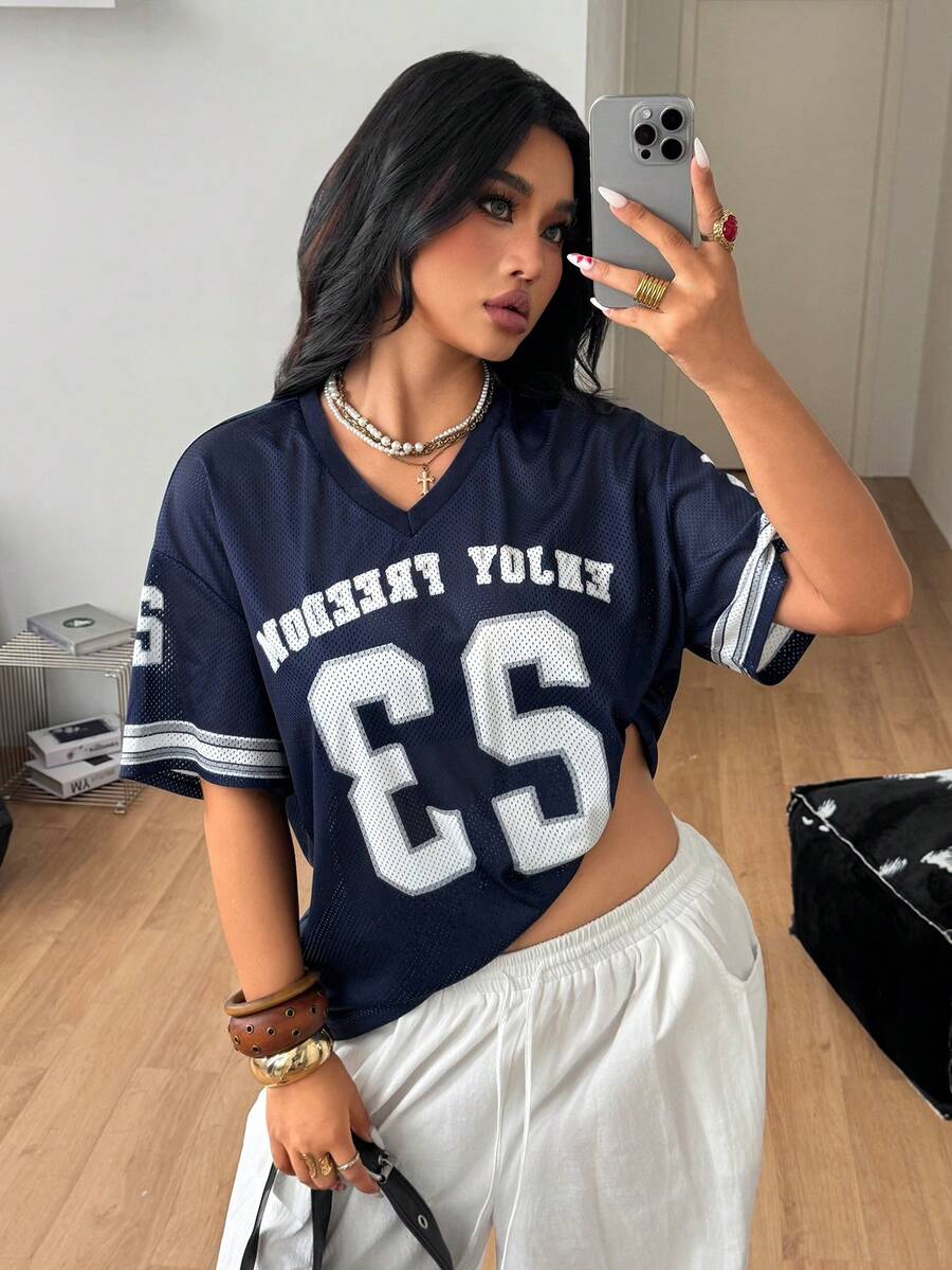 Navy blue plus size mesh baseball jersey t-shirt featuring a V-neck, raglan half sleeves, and sporty letter detailing.