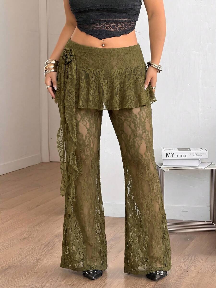 Black high-waist flare leg pants featuring contrast lace trim, floral ribbon detail, and semi-sheer knitted fabric.