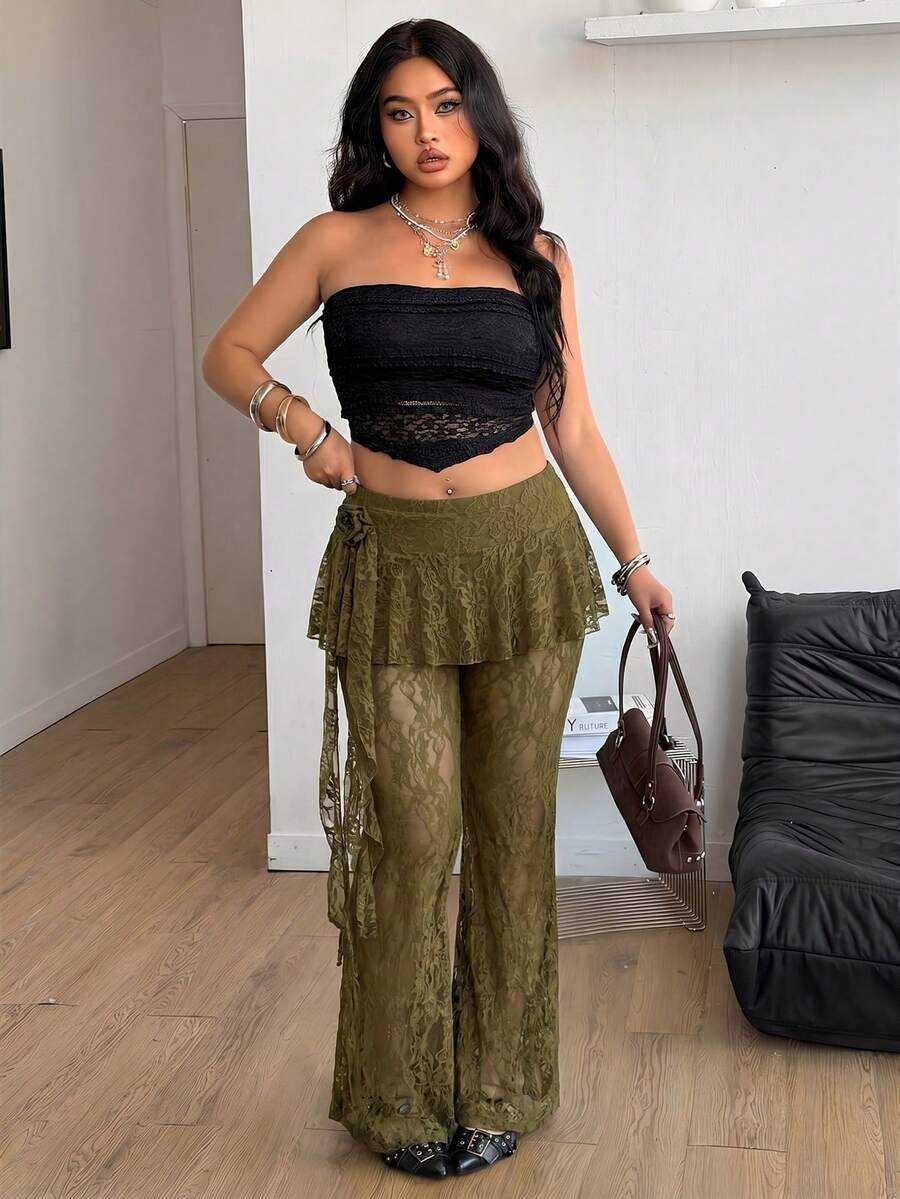 Black high-waist flare leg pants featuring contrast lace trim, floral ribbon detail, and semi-sheer knitted fabric.